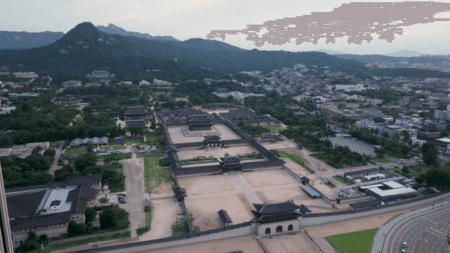 A historic palace surrounded by mountains