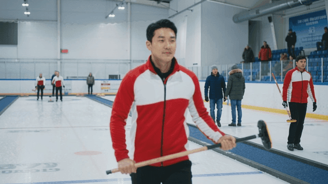 Curling player at ice rink