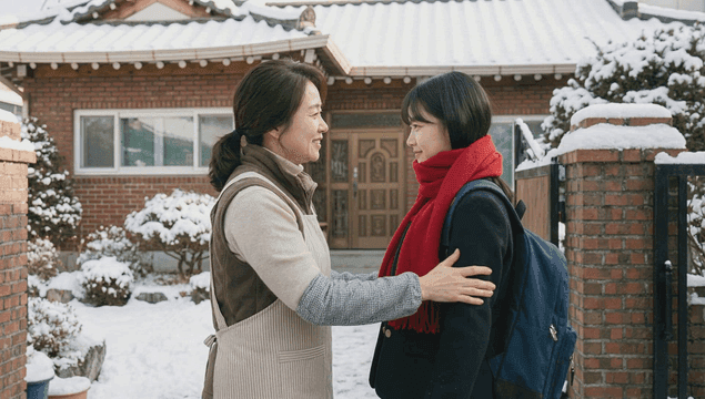 Mother and daughter in a snowy yard