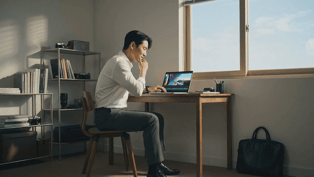 Man working on a laptop in a home office
