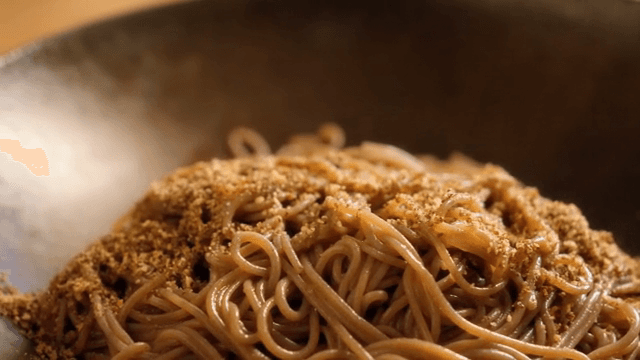Perilla oil buckwheat noodles with sesame seeds served on a plate