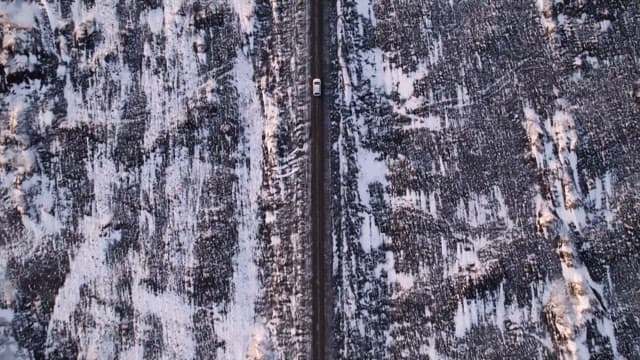 Car driving on a snowy road