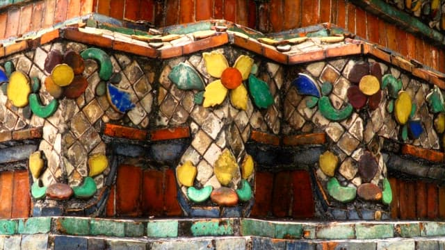 Ornate mosaic decoration of the architecture inside the Thai temple