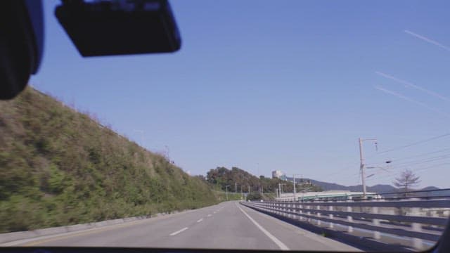 Driving on a countryside road on a bright sunny day