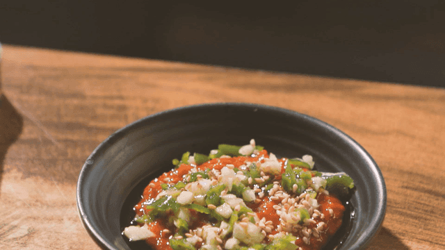 Bowl of ssamjang topped with chili peppers