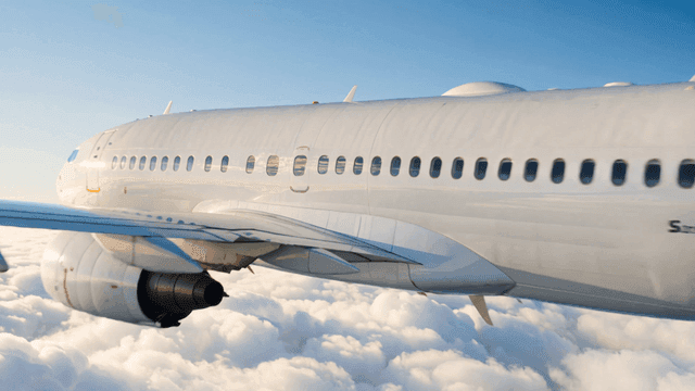 Airplane flying above the clouds