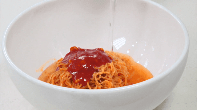 Soda poured over spicy bibim ramen