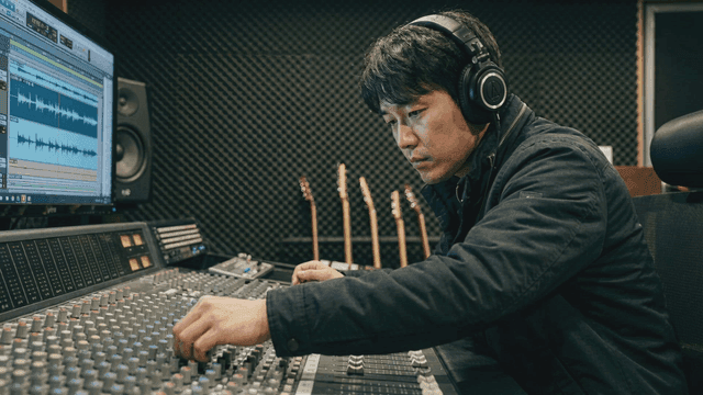 Sound engineer adjusting audio levels