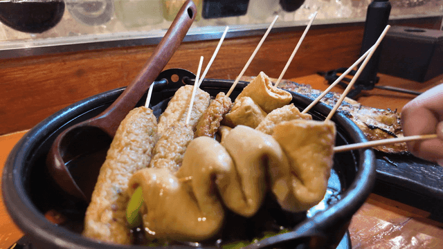 Fish cake skewers in broth
