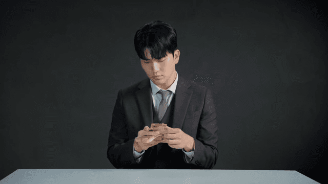 Man recounting money due to a mismatch in amount