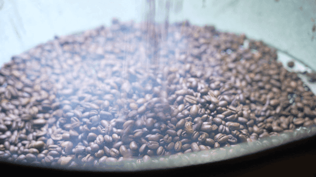 Dripping steaming coffee beans