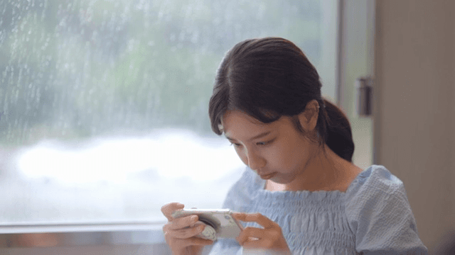 Woman taking pictures of food with smartphone
