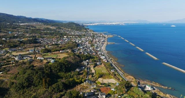 Coastal village with ocean and mountains