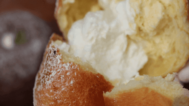 Cream-filled bread being torn open