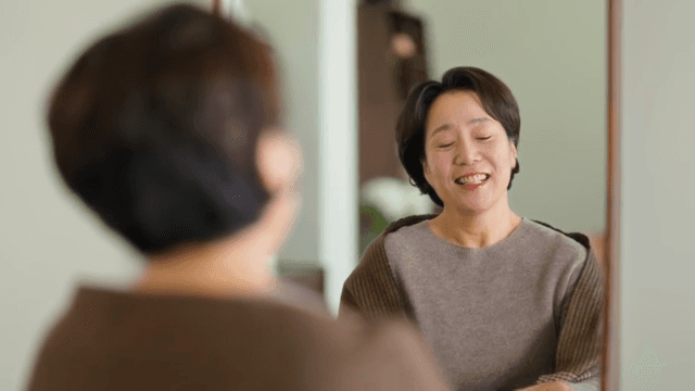 Woman smiling while talking on the phone