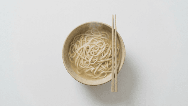 Bowl of kalguksu with chopsticks on it