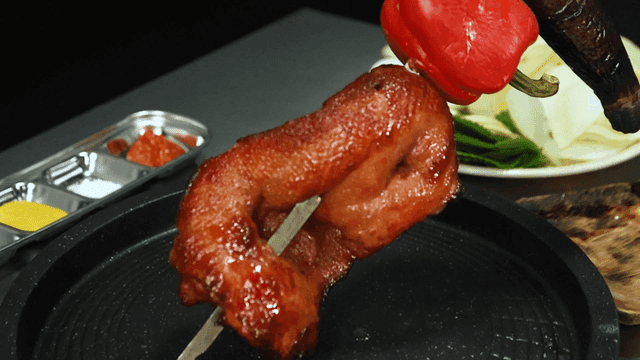 Grilled meat and vegetables on skewers