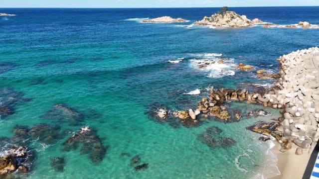 Clear blue sea with rocky shores