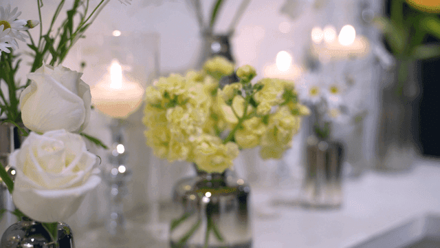 Candles and flowers on a decorated table