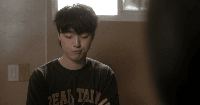 Young man talking in room