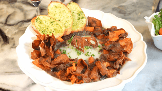 Beef Bourguignon served with garlic bread