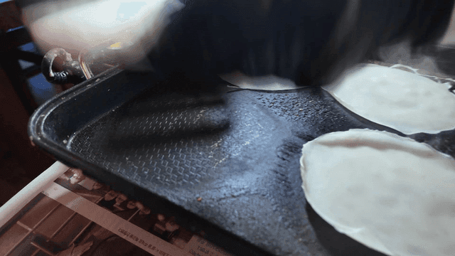 Thin pancakes spread and fried in pan