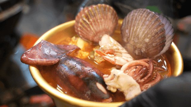 Seafood stew with scallops and squid