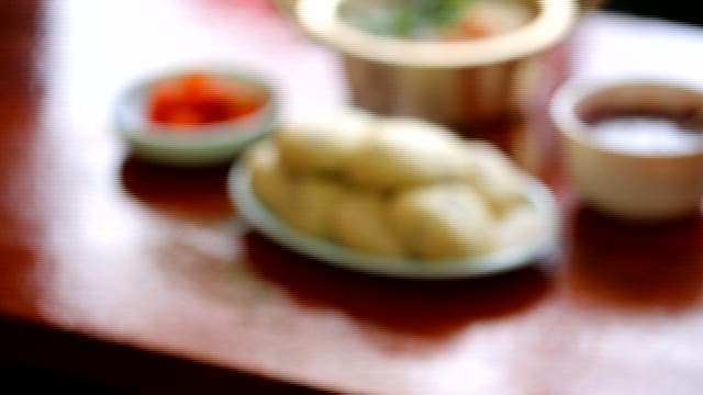 Steamy Traditional Korean Meal on a Table