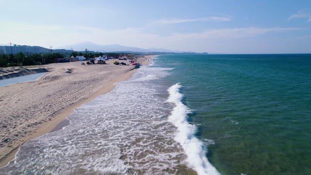 Beach with People Enjoying Leisure Activities