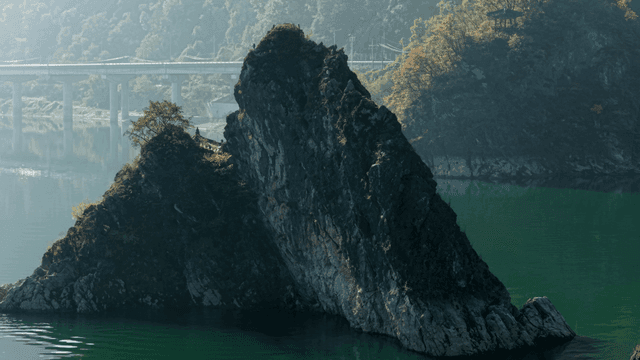 Rocky island in a serene lake