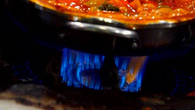 Spicy pork stew boiling in a pot