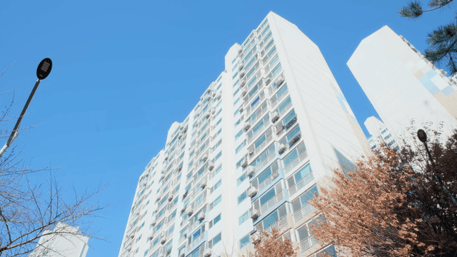 Tall apartment buildings under a clear sky