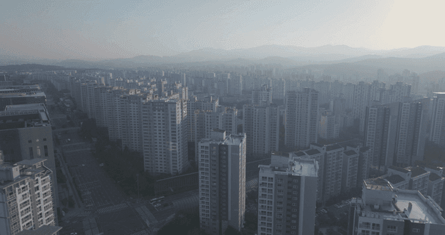 Vast city landscape with mountains in distance