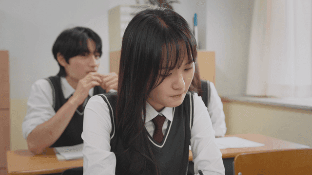 Smiling boy talking to a distressed girl