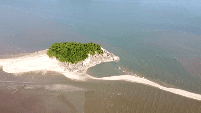 Sandy path leading to small island