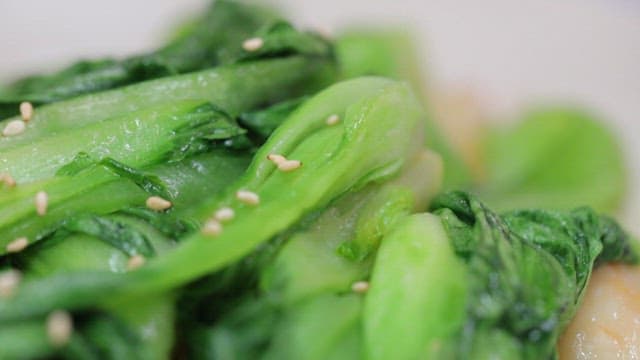 Stir-fried bok choy and pork with sesame seeds