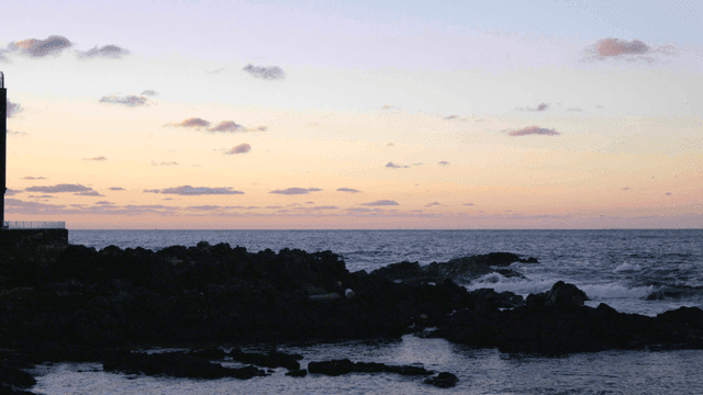 Tranquil coastal landscape at sunset
