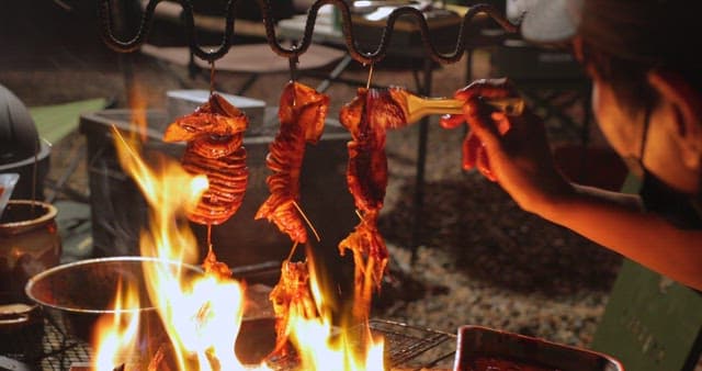 Sizzling squid being cooked on a grill