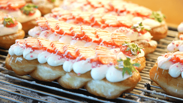 Twisted bread topped with strawberries and cream