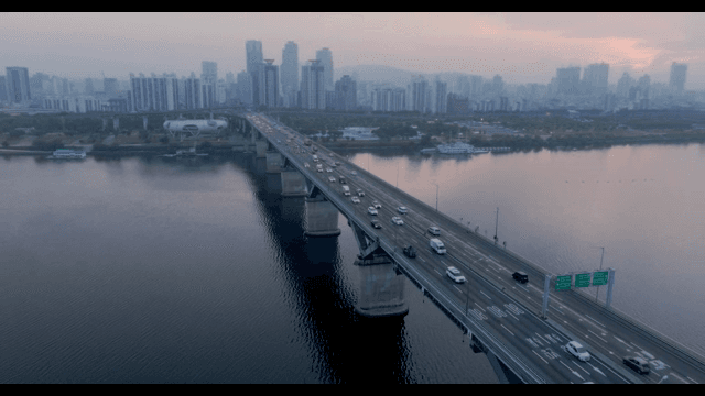 Bridge over a river with city skyline