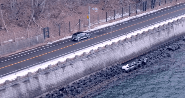 Car driving along a coastal road