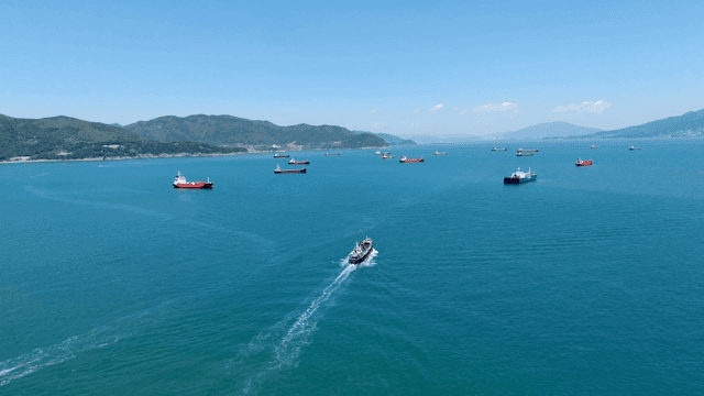 Ships sailing on a vast blue sea