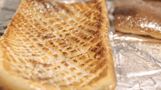 Grilled Pork Rinds on a foil-lined tray