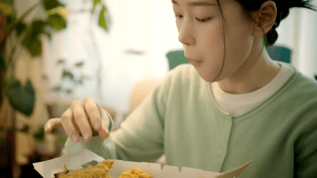 Woman enjoying fried chicken