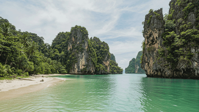 Quiet beach with towering cliffs