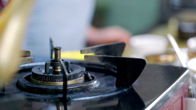 Person pouring hot water into a cup