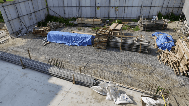 Construction site with materials and scaffolding