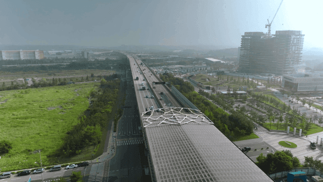 Surrounding construction landscape and busy highway