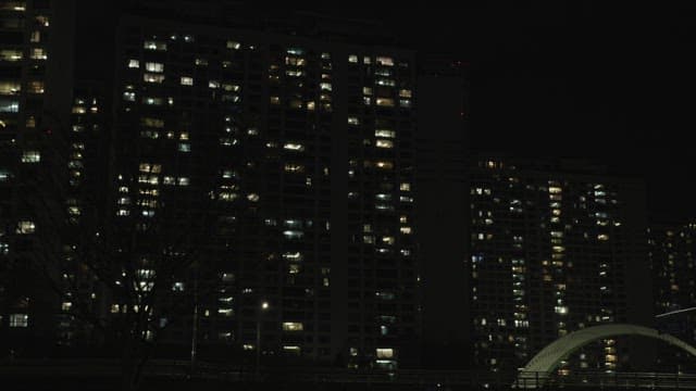 Night View of Apartment Buildings with Lit Windows