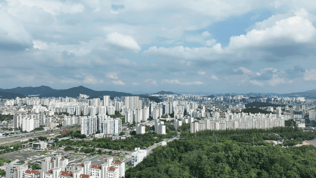 City view with high-rise apartment complexes and greenery